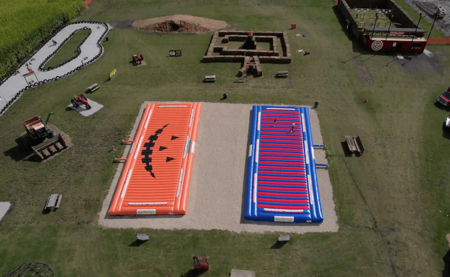 Aerial view of farm activities including jump pads and go-karts